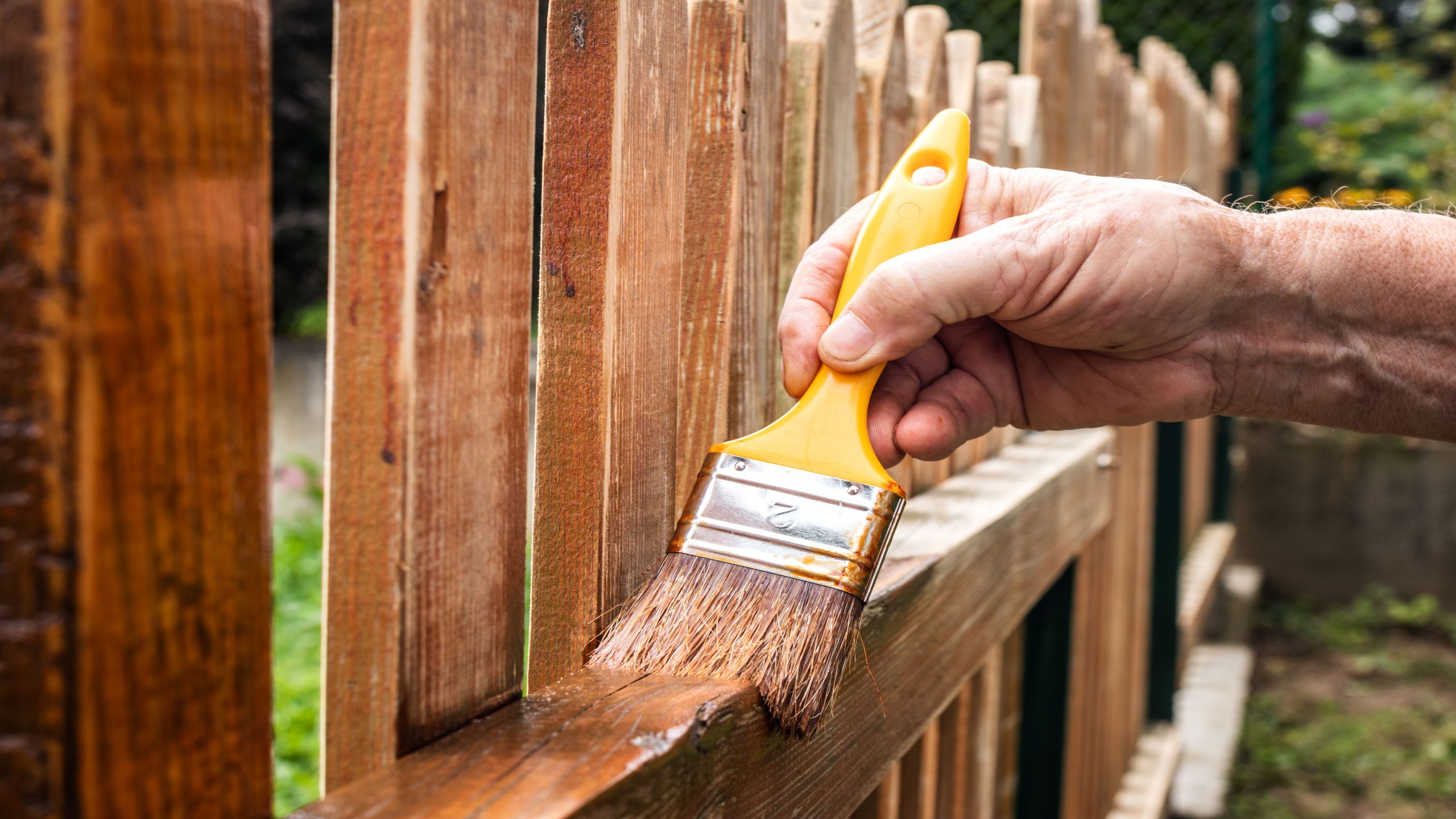 Fence painting team in London